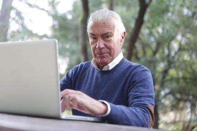 Elderly gentleman on a laptop